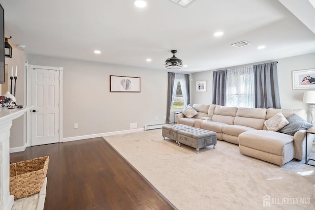 242 Green St, Old Bridge, NJ 08857 - living area featuring a baseboard heating unit, recessed lighting, and wood finished floors
