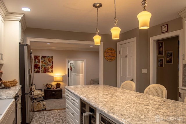 20 Wedgewood Ct, East Brunswick, NJ 08816 - kitchen featuring freestanding refrigerator, white cabinets, pendant lighting, recessed lighting, and ornamental molding