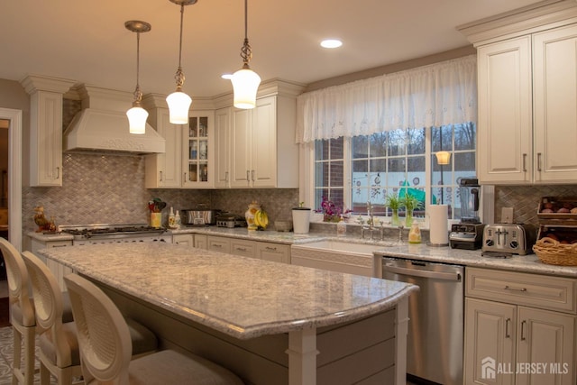 20 Wedgewood Ct, East Brunswick, NJ 08816 - kitchen featuring a sink, backsplash, a kitchen bar, custom range hood, and appliances with stainless steel finishes