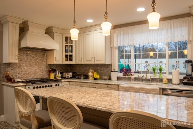 20 Wedgewood Ct, East Brunswick, NJ 08816 - kitchen featuring a sink, custom exhaust hood, hanging light fixtures, and glass insert cabinets