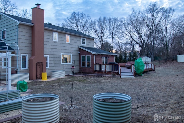 20 Wedgewood Ct, East Brunswick, NJ 08816 - rear view of house featuring a chimney and a wooden deck