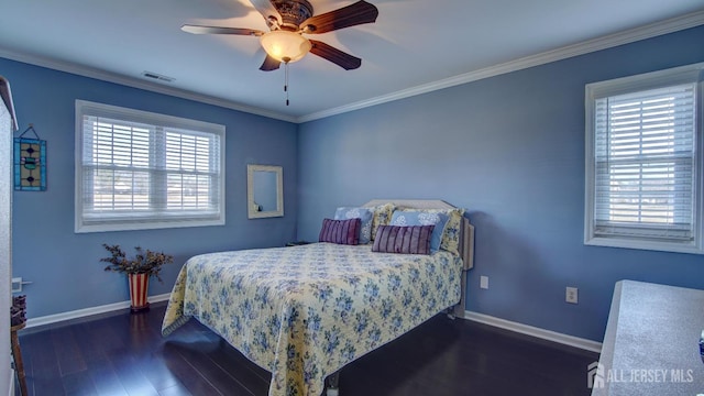 bedroom with ceiling fan, dark wood-type flooring, visible vents, baseboards, and ornamental molding