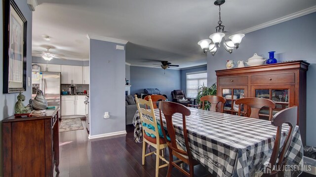 dining room featuring dark wood-style floors, baseboards, ornamental molding, and ceiling fan with notable chandelier