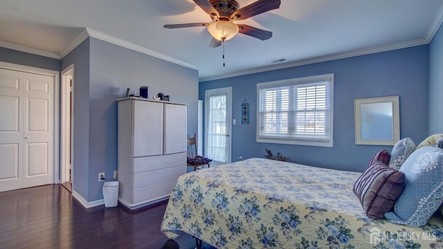 bedroom with baseboards, visible vents, ornamental molding, and dark wood-style flooring