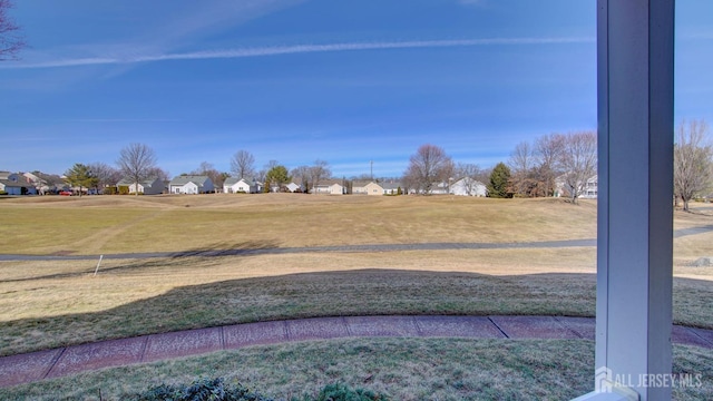 view of yard featuring a residential view