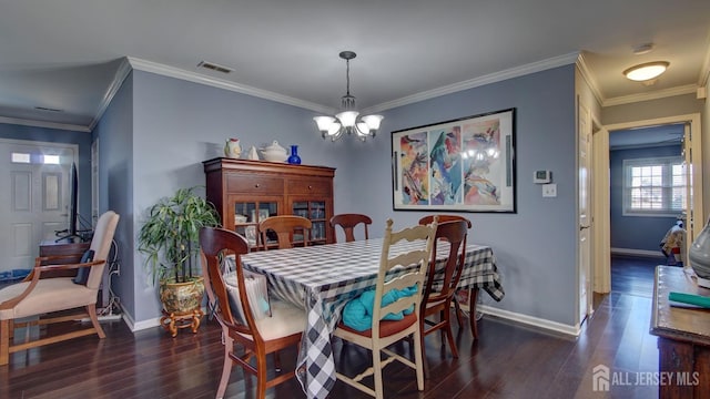 dining area featuring a chandelier, visible vents, dark wood finished floors, and baseboards