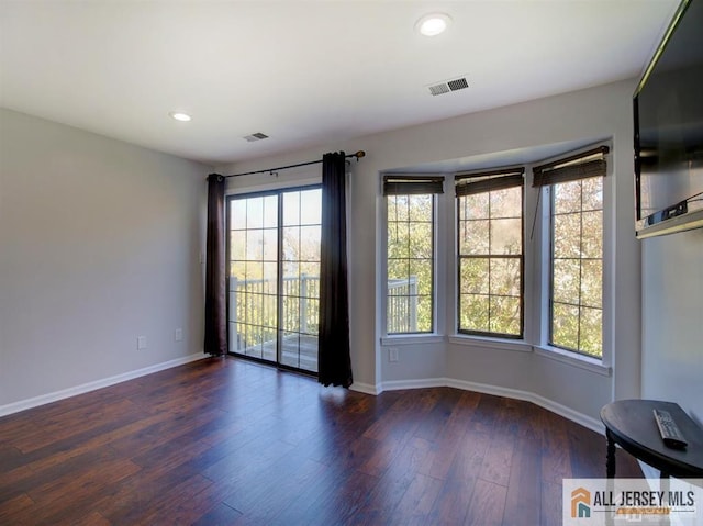 105 Longfield Ct Unit 105, East Brunswick, NJ 08816 - empty room with dark wood-style flooring and recessed lighting