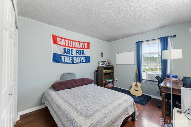 76 Lynnette Ct, South Brunswick, NJ 08824 - bedroom featuring hardwood / wood-style flooring, a textured ceiling, and cooling unit