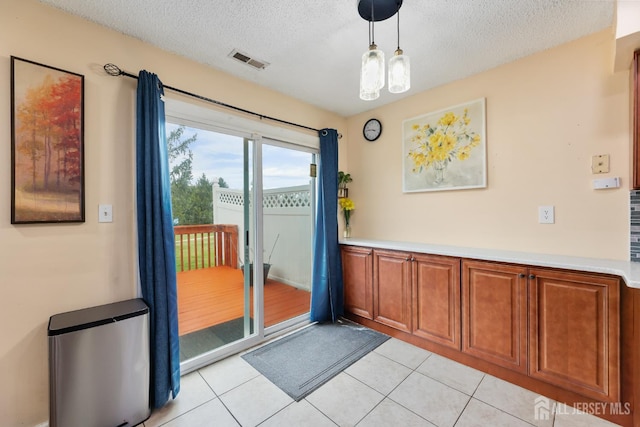 76 Lynnette Ct, South Brunswick, NJ 08824 - entryway featuring a textured ceiling and light tile patterned floors