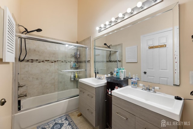 76 Lynnette Ct, South Brunswick, NJ 08824 - full bath featuring two vanities, combined bath / shower with glass door, and tile patterned floors