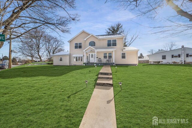 view of front of house with a front lawn