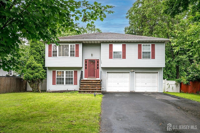 164 Mahar Ave, South Plainfield, NJ 07080 - raised ranch featuring asphalt driveway, a garage, and roof with shingles