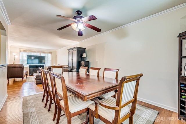 164 Mahar Ave, South Plainfield, NJ 07080 - dining area featuring ceiling fan, ornamental molding, and light wood-style flooring