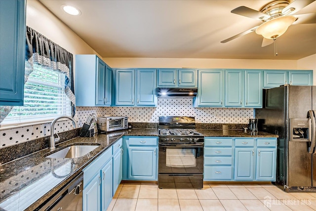 164 Mahar Ave, South Plainfield, NJ 07080 - kitchen with black appliances, under cabinet range hood, blue cabinetry, and dark stone counters