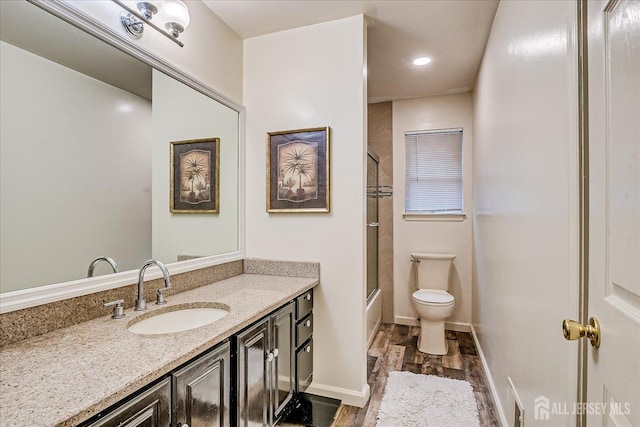 164 Mahar Ave, South Plainfield, NJ 07080 - full bathroom with vanity, wood finished floors, bath / shower combo with glass door, and recessed lighting