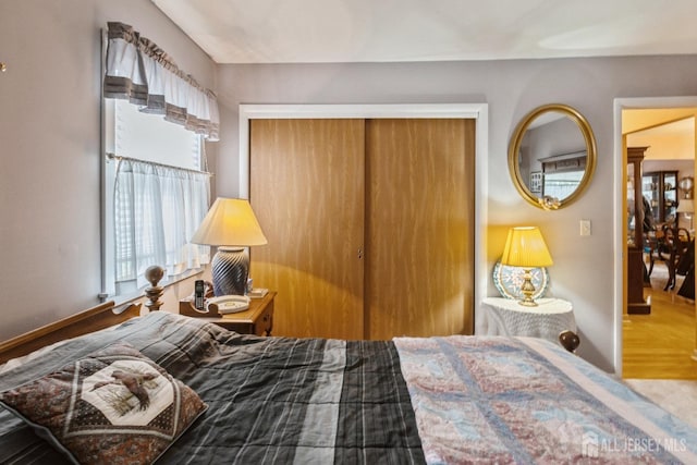 bedroom featuring a closet and baseboards