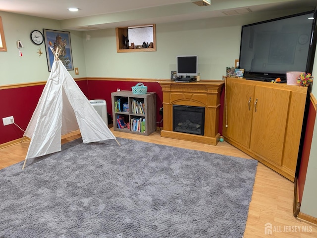 33 Cypress St, Carteret, NJ 07008 - recreation room with wood finished floors, a fireplace, and recessed lighting