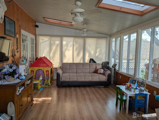 33 Cypress St, Carteret, NJ 07008 - sunroom / solarium with wood walls, a skylight, lofted ceiling, wood finished floors, and a deck