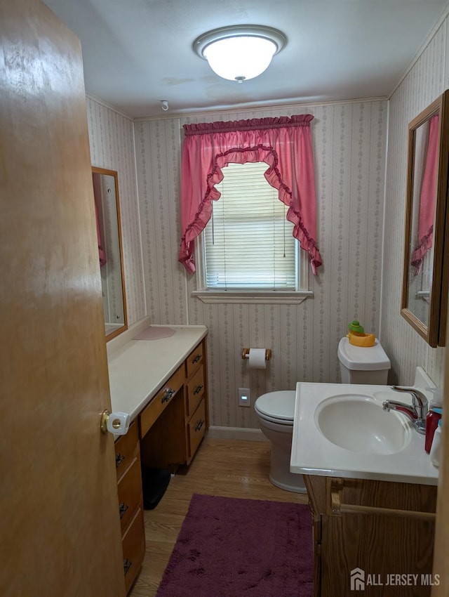 33 Cypress St, Carteret, NJ 07008 - bathroom featuring vanity, wood finished floors, and wallpapered walls