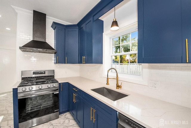 kitchen with a sink, marble finish floor, wall chimney range hood, hanging light fixtures, and stainless steel gas stove