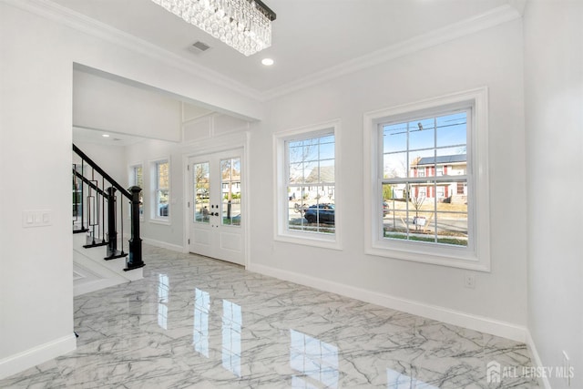 entrance foyer featuring baseboards, stairway, and crown molding