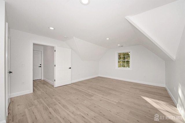 bonus room featuring lofted ceiling, recessed lighting, baseboards, and light wood-style floors