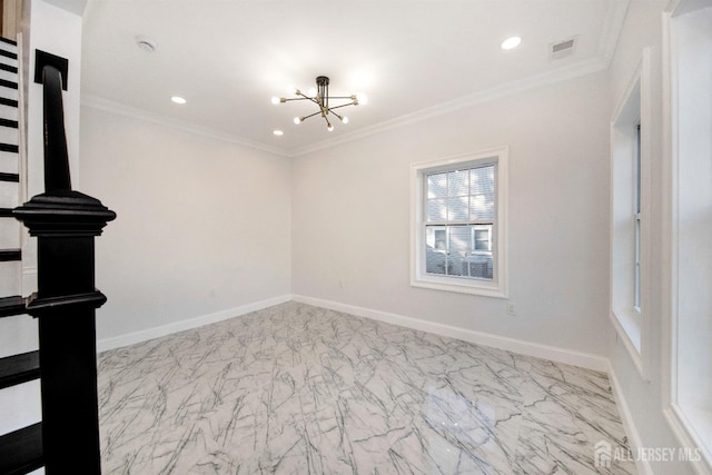 spare room with crown molding and baseboards