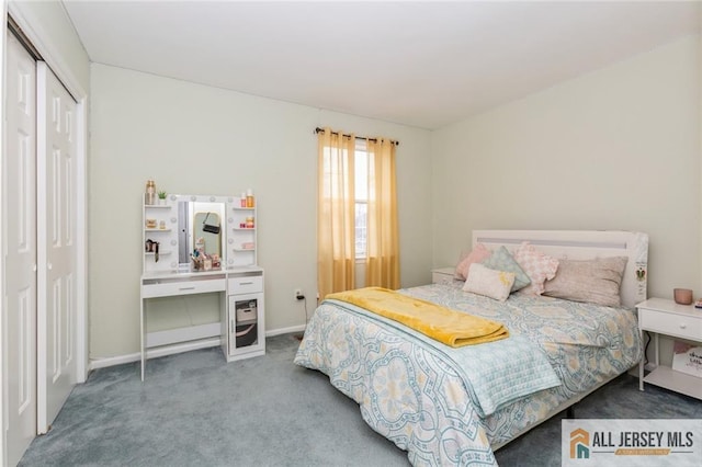 carpeted bedroom with baseboards and a closet