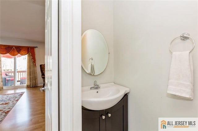 bathroom with vanity and wood finished floors