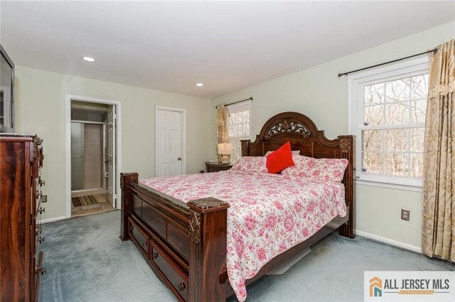 bedroom with recessed lighting, baseboards, and light carpet