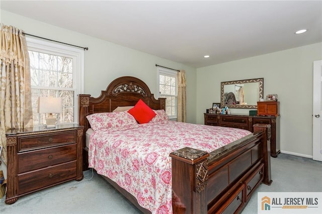 bedroom with recessed lighting, baseboards, and light carpet