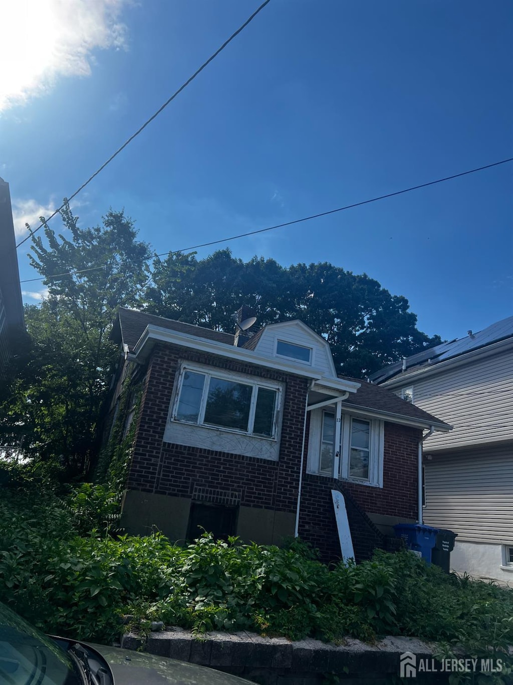 13 Ling St, Fords, NJ 08863 - view of front of property featuring brick siding and a gambrel roof