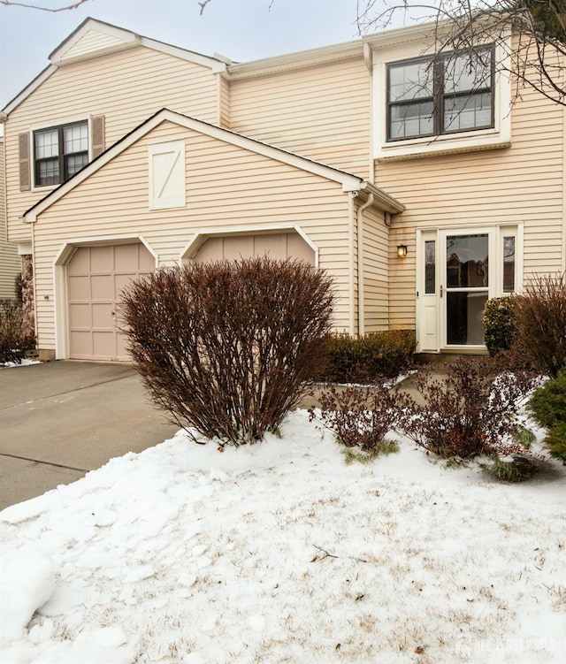 exterior space featuring a garage and driveway