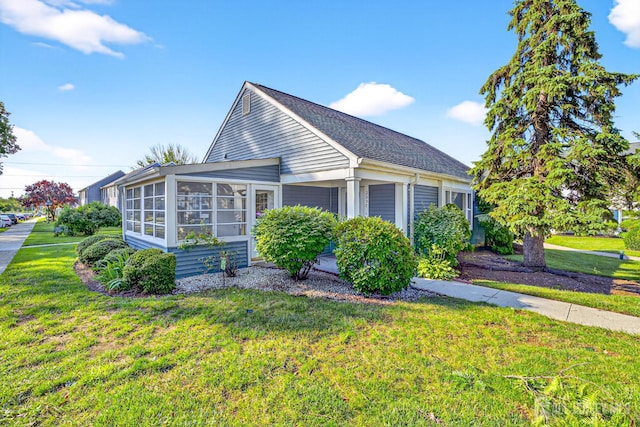 203 Rossmoor Dr Unit C, Monroe, NJ 08831 - view of side of home featuring a sunroom, a yard, and roof with shingles