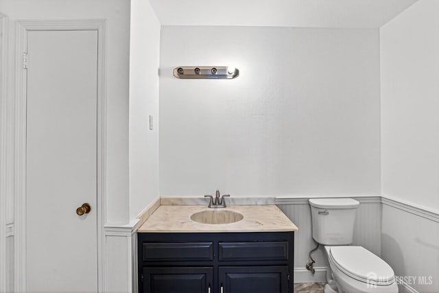 203 Rossmoor Dr Unit C, Monroe, NJ 08831 - half bath with vanity and a wainscoted wall