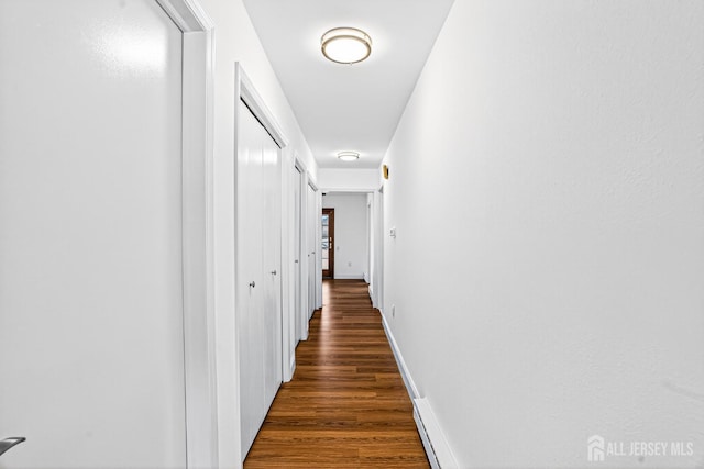 203 Rossmoor Dr Unit C, Monroe, NJ 08831 - hallway featuring wood finished floors and baseboards