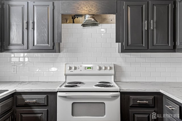 203 Rossmoor Dr Unit C, Monroe, NJ 08831 - kitchen with white electric range oven, decorative backsplash, and light stone counters