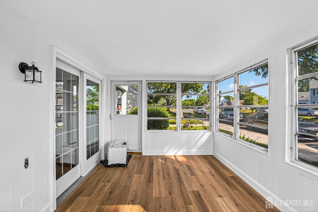 203 Rossmoor Dr Unit C, Monroe, NJ 08831 - unfurnished sunroom with wood finished floors, a decorative wall, and french doors