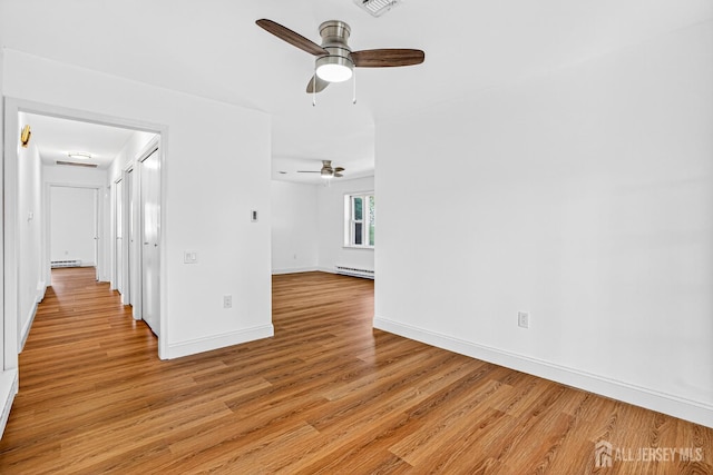 203 Rossmoor Dr Unit C, Monroe, NJ 08831 - empty room with a ceiling fan, a baseboard radiator, and light wood-type flooring