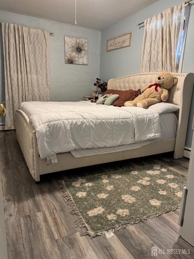 3350 E Washington Rd, Parlin, NJ 08859 - bedroom with wood finished floors and a baseboard heating unit