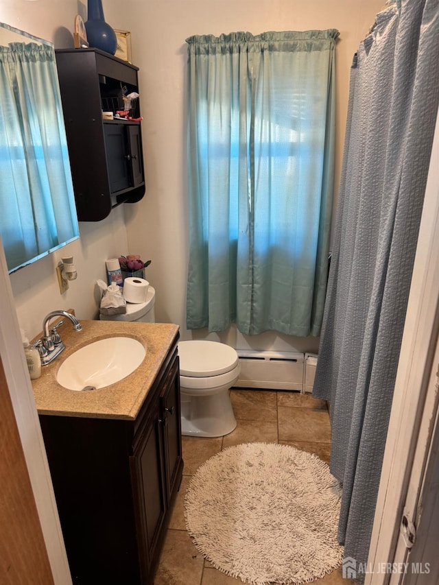 3350 E Washington Rd, Parlin, NJ 08859 - bathroom with baseboard heating, toilet, tile patterned flooring, vanity, and curtained shower