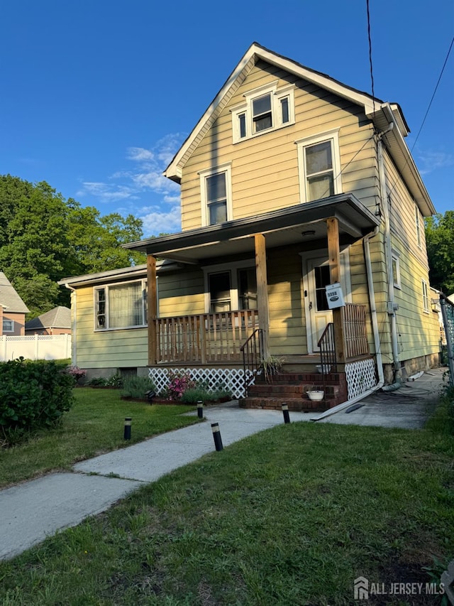 3350 E Washington Rd, Parlin, NJ 08859 - view of front facade with covered porch and a front lawn