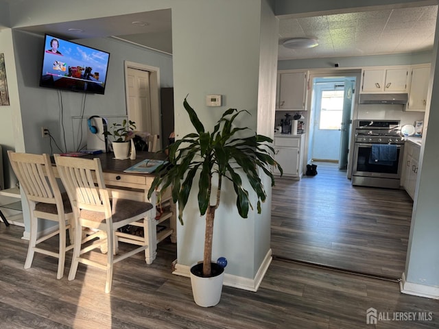 3350 E Washington Rd, Parlin, NJ 08859 - dining area with dark wood finished floors and baseboards