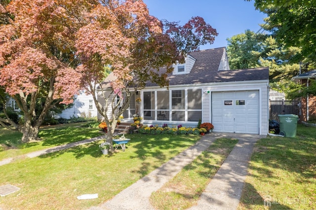 view of front facade featuring a garage and a front yard