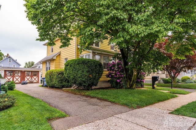 11 Jean Ct, Woodbridge Proper, NJ 07095 - view of front facade with a front lawn and an outdoor structure