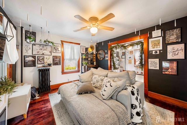 11 Jean Ct, Woodbridge Proper, NJ 07095 - living area with radiator, dark wood finished floors, ceiling fan, and baseboards