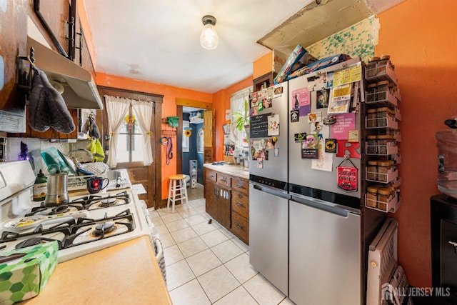 11 Jean Ct, Woodbridge Proper, NJ 07095 - kitchen featuring freestanding refrigerator, white gas range oven, and light tile patterned floors