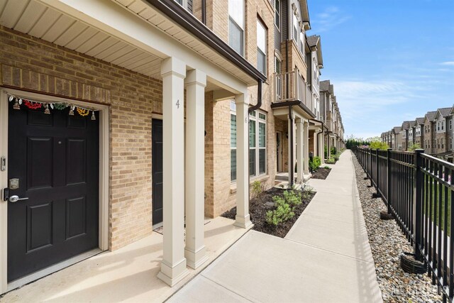 4 Arnold Dr Unit 5302, Wood-Ridge, NJ 07075 - view of exterior entry featuring brick siding and a residential view