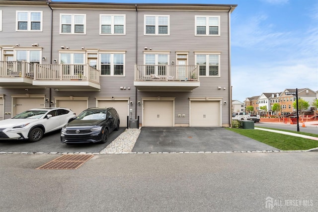 4 Arnold Dr Unit 5302, Wood-Ridge, NJ 07075 - view of property with an attached garage, driveway, and a residential view