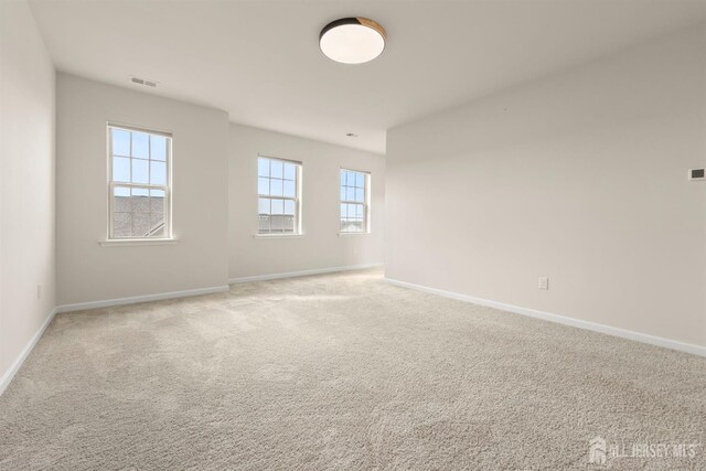 4 Arnold Dr Unit 5302, Wood-Ridge, NJ 07075 - unfurnished room featuring baseboards and light colored carpet